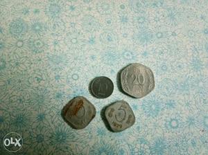 Four Silver-colored Indian Coins