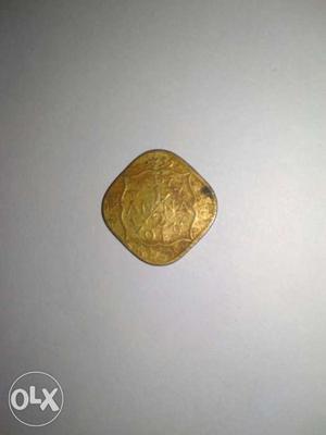Half anna old golden coin
