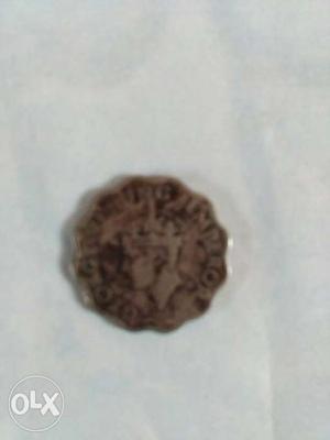 Scalloped Edge Emperor George Silver Coin