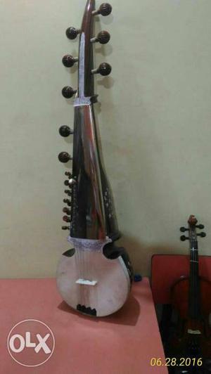 Silver And Black String Instrument