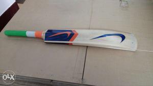 White, Blue, Orange And Green Nike Cricket Paddle