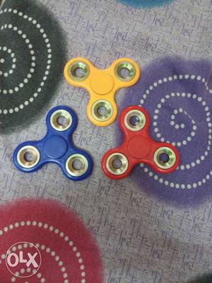 Yellow, Blue, And Red Fidget Spinners