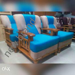 Brown Wooden Armchair With Blue And Gray Cushions