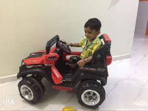 Children's Red And Black Ride On Toy Car