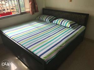 Good condition 6*6 foot king size iron bed with storage only