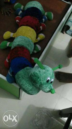 Green, Blue, And Yellow Multi-colored Caterpillar Plush Toy