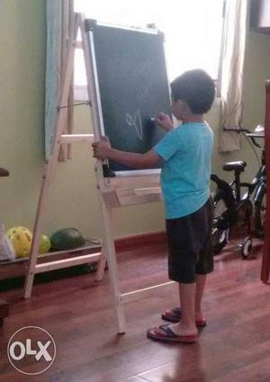 Green Board On Brown Wooden Easel