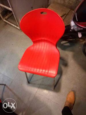 Red Plastic Chair With Gray Steel Base