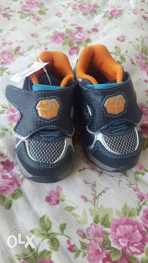 Toddler's Pair Of Black And Orange Shoes