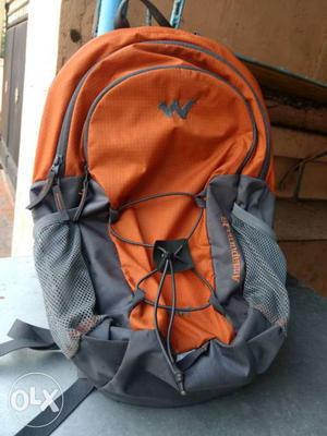 Wildcraft mini travel bag orange colour with bill