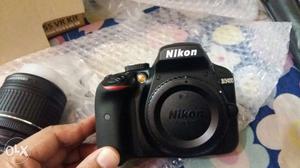 Black Nikon DLSR Camera And Lens