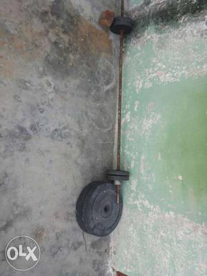 Black Weight Plate And Barbell Handle Bar