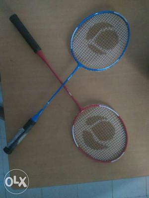 One Blue And One Red Badminton Rackets
