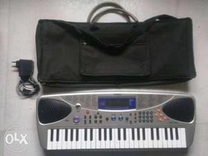 Piano from Casio + piano charger + piano cover
