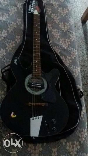 Semi-acoustic black colour guitar in mint