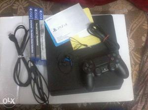 Sony PS4 Console, DualShock 4, And Three Game Cases