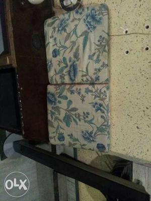 Two Beige-and-blue Floral Pads