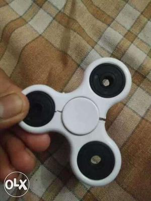 White and orange fidget spinner buy both at just Rs. 80