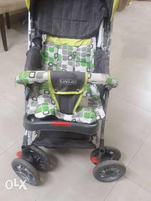Black, Yellow, And Green Stroller