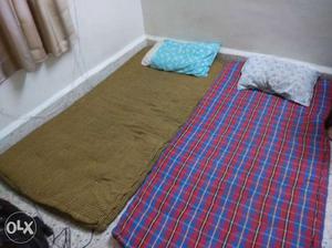 Blue, Red, And Brown Bed Textiles