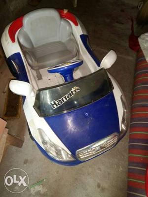 Children's White, Blue And Red Ride On Toy Car