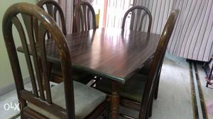 Dinning table with wooden top with six chairs