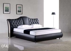 King size black colour bed with soft cutions
