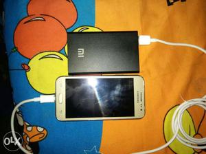 Samsung J2 with power bank charger headphone 7