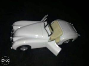 White And Beige Toy Car