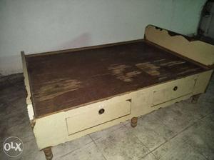Wooden Cot good condition with storage