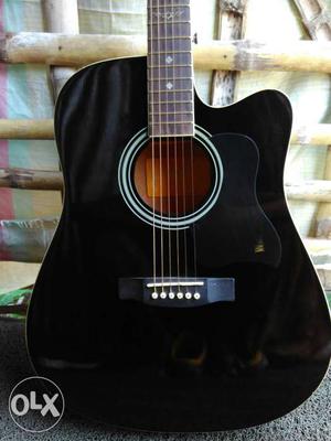 2months old acoustic guitar in excellent condition Price is