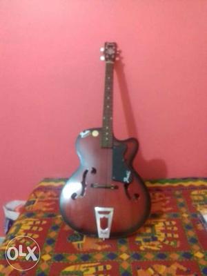 6 month old guitar red$black combination cheap and best,