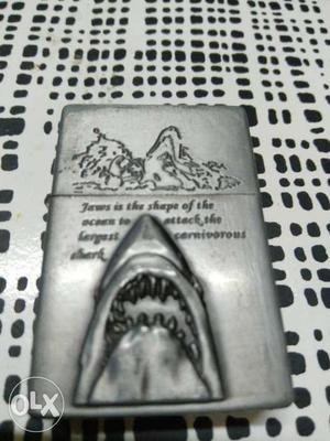 Antique Zippo and jaws themed lighter, price on
