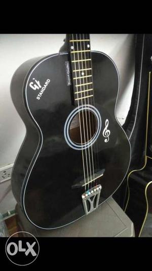Black color pure acoustic guitar in half price,