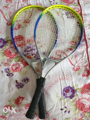 Blue-and-green Cosco Tennis Rackets