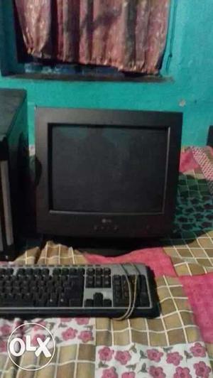 Black CRT Computer Monitor With Grey And Black Corded
