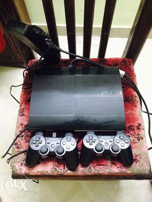 Black Sony PS3 Superslim Console With Controllers. with 12
