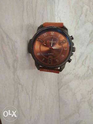 Men watch with brown color at lowest price