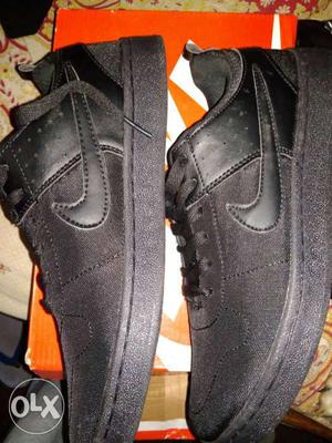 Pair Of Black Nike Low Top Shoes