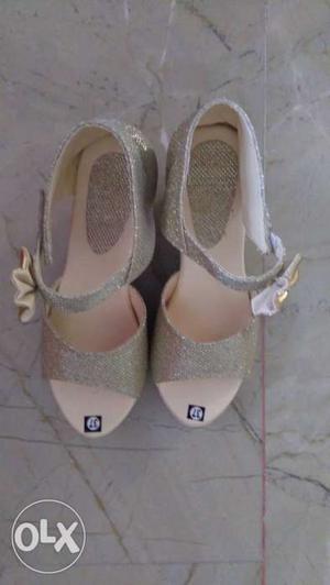 Pair Of Gray Glittered Ankle Strap Heel Sandals