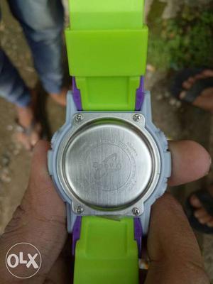 Round Silver Casio Baby-G Watch With Green Strap