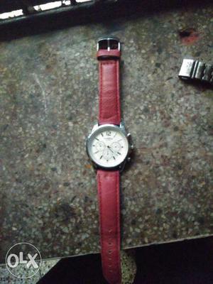 Round Silver Chronograph Wrist Watch With Red Leather Strap