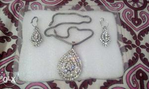 Silver And Necklace With Pendant And Earrings