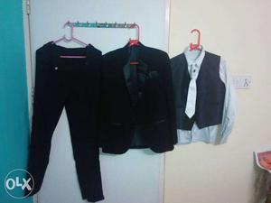 Three piece suit in new condition perfect for 14