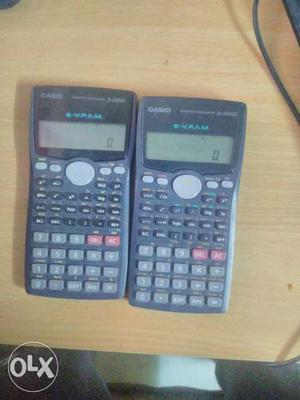 Two Black Casio Scientific Calculators