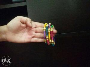 Yellow, Purple, And Red Thread Bangles