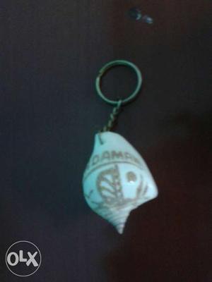 A shell keychain new one and antique