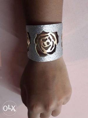 Designer bangle silver colour with golden flower