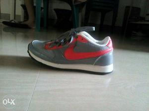Gray And Pink Nike used Running Shoe