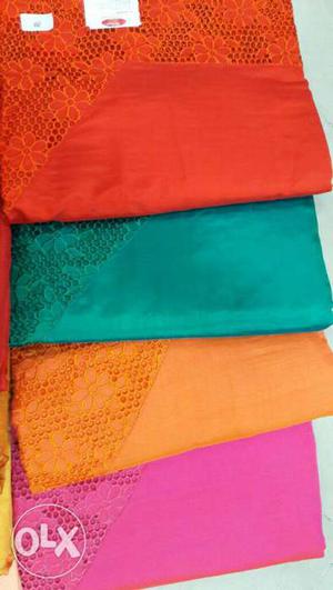 Orange, Green, Yellow, And Pink Textiles